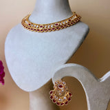 Gold-colored jewelry set with gold-colored and red stones