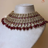 Bronze-colored large jewelry set with red stones and beads