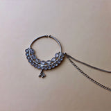 Silver colored large nose ring with double row of stones and double hair chain