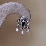 Zilverkleurige sieradenset met olifanten, parels en groene stenen