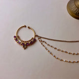 Gold-colored medium-sized nose ring with pink stones and hair chains