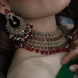 Bronze-colored large jewelry set with red stones and beads