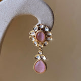 Gold-colored jewelry set with pink stones and pearls