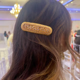 Gold colored large hairpin with stones