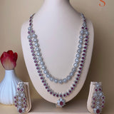 Silver-colored large jewelry set with cherry red stones 