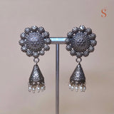 Silver colored button earrings with small jhumka