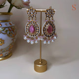 Gold-colored large earrings with beautiful pink stones and pearls