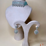 Silver-colored jewelry set with light blue stones