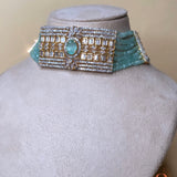 Gold-colored jewelry set with light blue beads