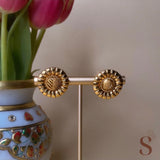 Gold colored button earrings